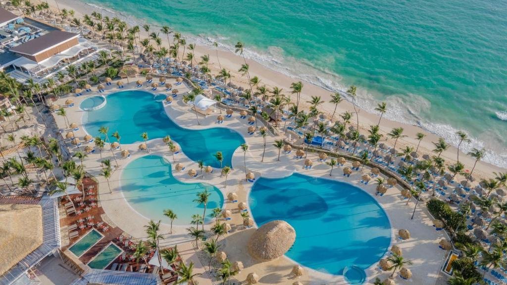 Lake-style swimming pool and tropical bridges at Bahia Principe Grand Punta Cana