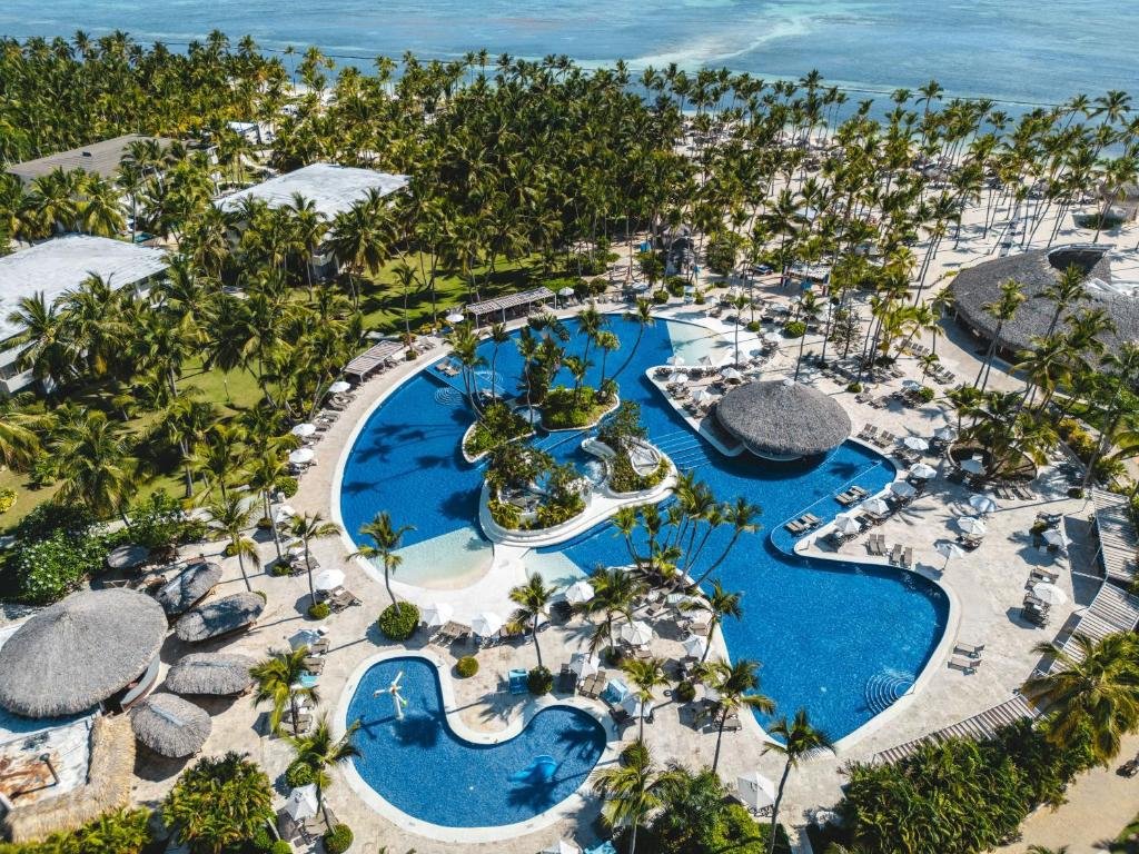 Massive lagoon swimming pool with palm islands at Catalonia Bavaro Beach Resort