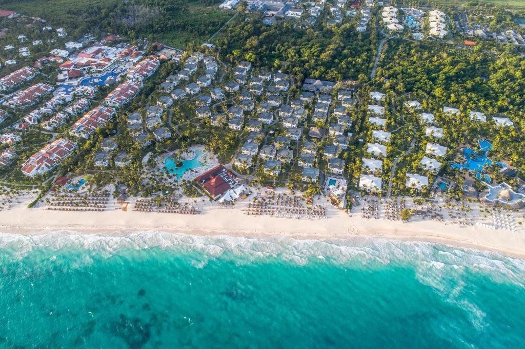 Beachfront swimming pool and palm trees at Grand Bavaro Princess Punta Cana