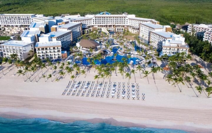 Aerial view of Hyatt Ziva Cap Cana infinity pools and turquoise Juanillo Beach