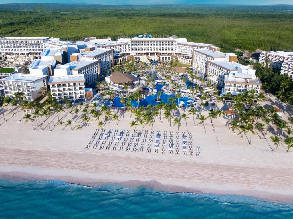 Aerial view of Hyatt Ziva Cap Cana infinity pools and turquoise Juanillo Beach