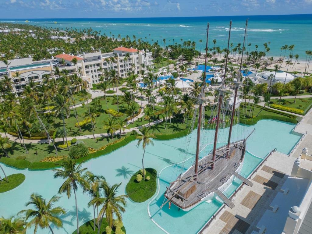 Oceanfront pools and Spanish galleon ship bar at JOIA Bavaro by Iberostar