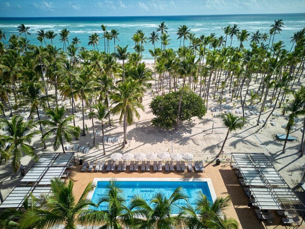 Renovated oceanfront swimming pools and palm grove at Hotel Riu Palace Macao Adults Only