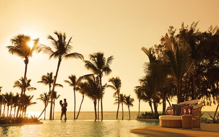 Lagoon pool and palm-fringed Juanillo Beach at Secrets Cap Cana Resort & Spa
