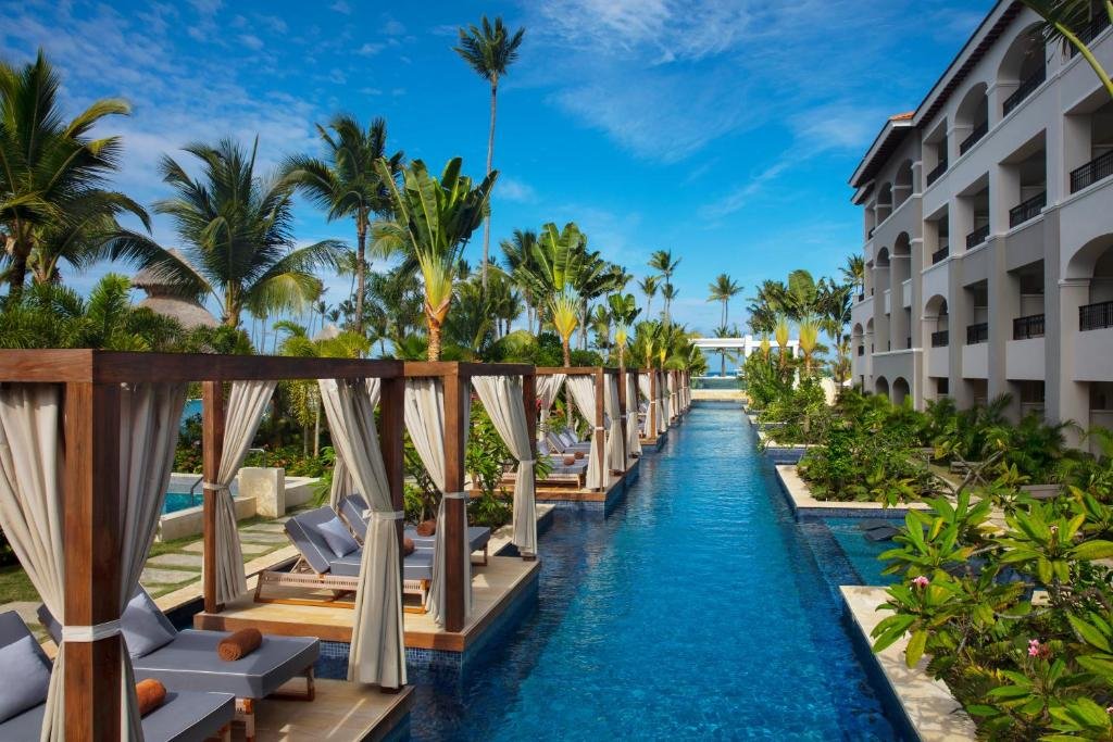Tropical main pool and swim-up bar at Secrets Royal Beach Punta Cana
