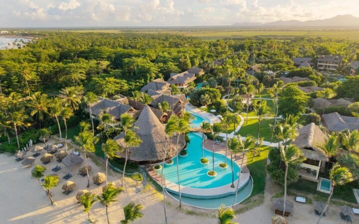 Serpentine infinity pool and thatched suites at Zoetry Agua Punta Cana
